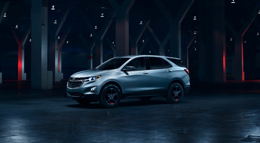 A silver 2018 Chevy Equinox Redline is shown after leaving a Mississippi used car lot.