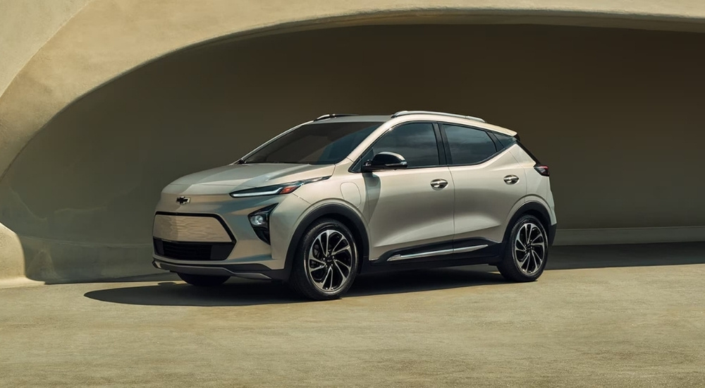 A tan 2022 Chevy Bolt EUV is shown in an alcove.