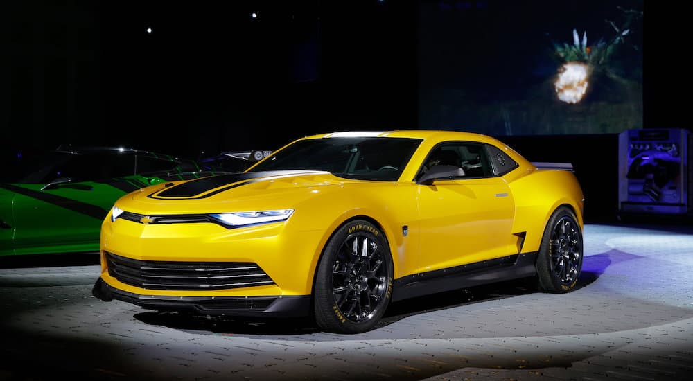 A yellow 2013 Chevy Camaro is shown after leaving a Tupelo used car dealer.