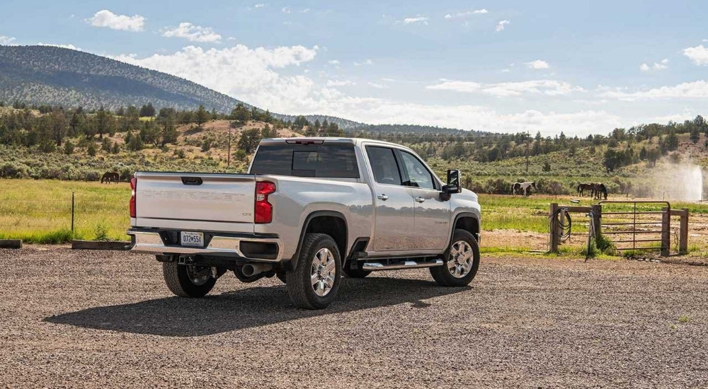 A silver 2022 Chevy Silverado 2500 HD High Country is shown from the rear.