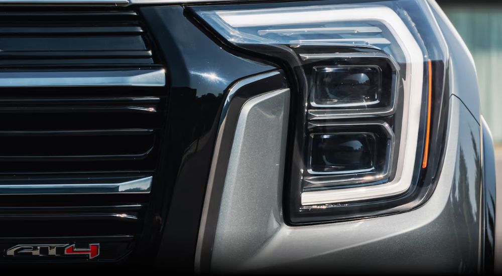 A grey 2025 GMC Terrain AT4 is shown in close-up.