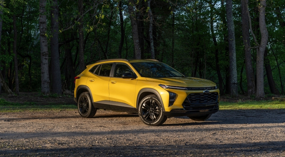 A yellow 2024 Chevy Trax Activ is shown from the front at an angle.