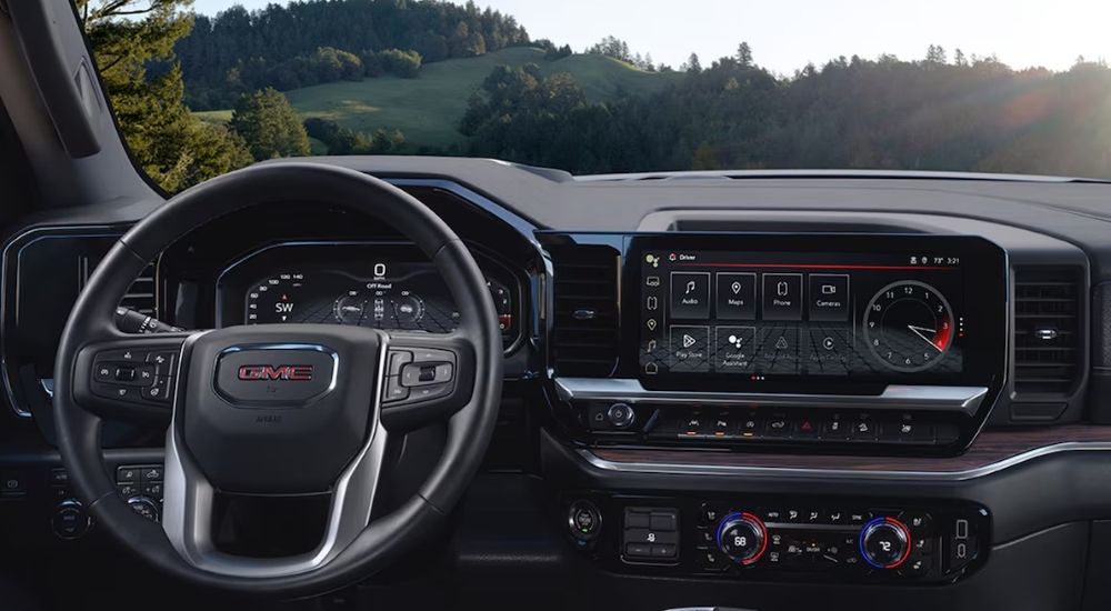 Steering wheel and infotainment in a 2025 GMC Sierra 1500.