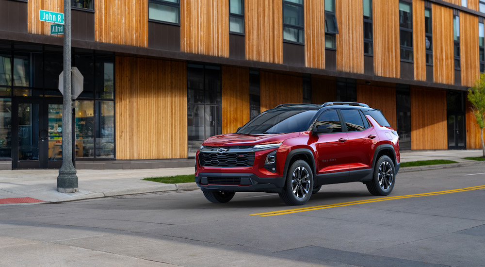 A red 2025 Chevy Equinox from the front at an angle.