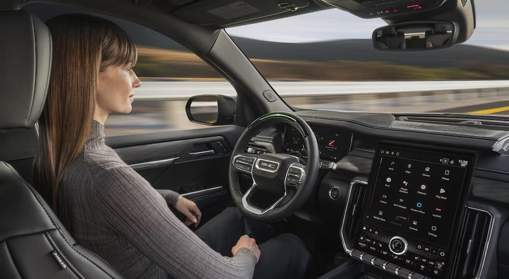 A person using Super Cruise in a 2025 GMC Acadia.