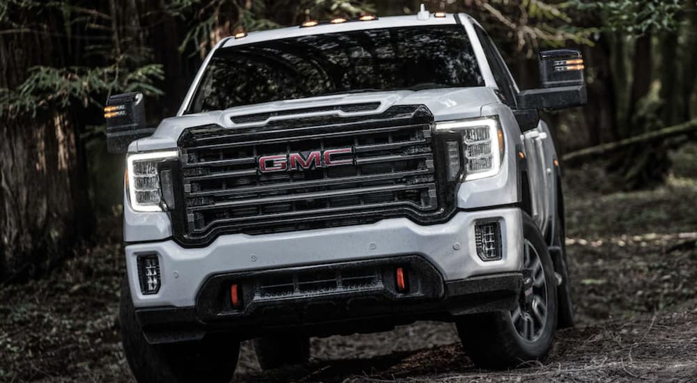 A white 2023 GMC Sierra 2500 HD AT4 from a dealer with used GMC trucks for sale
