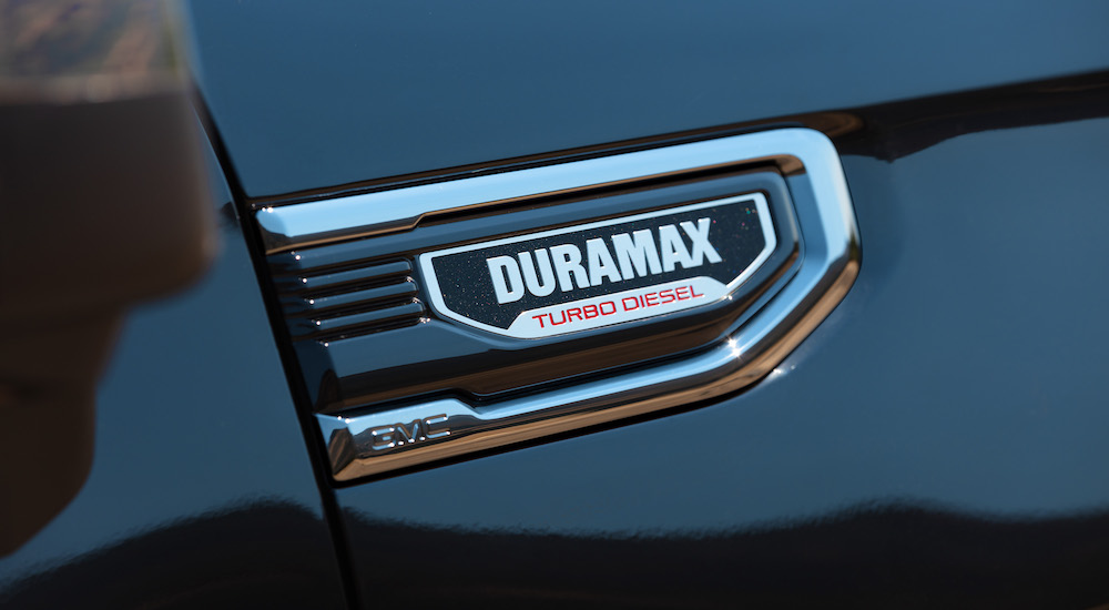 The badge on a black 2025 GMC Sierra 2500 in close.