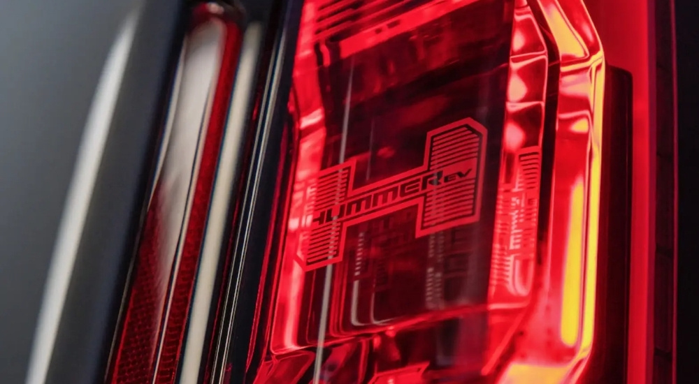 A close-up of the tail light with the Hummer logo on a 2022 GMC Hummer EV.