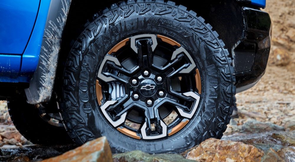 Front passenger wheel on a blue 2022 Chevy Silverado 1500 ZR2