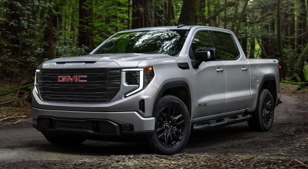 Silver 2022 GMC Sierra 1500 Elevation driving on a trail
