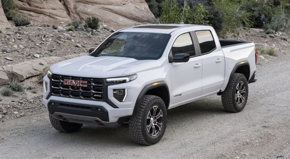 White 2023 GMC Canyon AT4 parked off-road