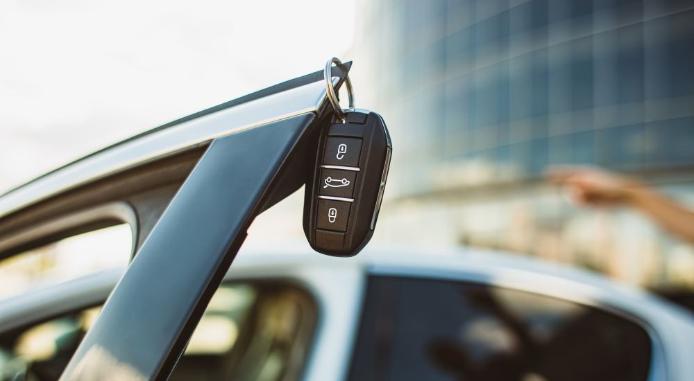 A key fob is shown on a door after the owner went to 'sell my car.'