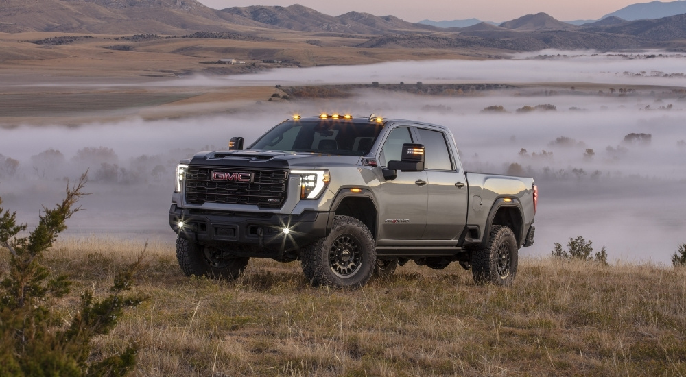 A grey 2025 GMC Sierra 2500 HD AT4X AEV is shown after visiting a GMC dealer.