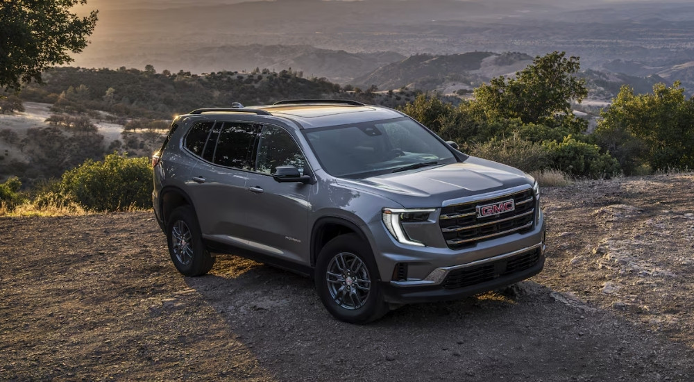 Grey 2025 GMC Acadia Elevation parked at an overlook