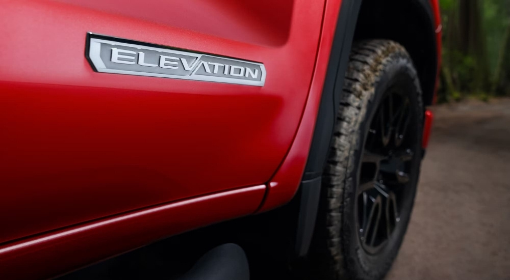 Close-up of the Elevation badge on a red 2025 GMC Sierra 1500 Elevation.