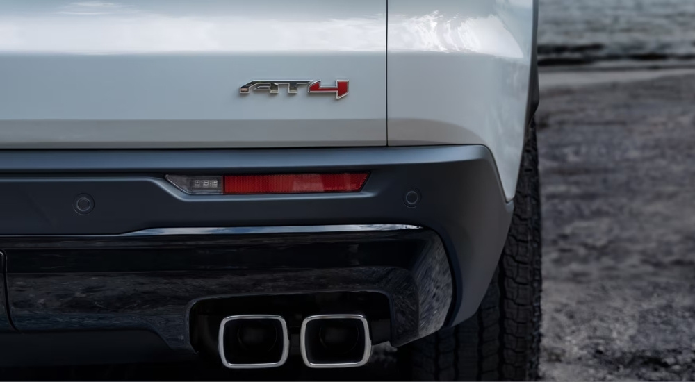 Rear of a white 2025 GMC Acadia AT4