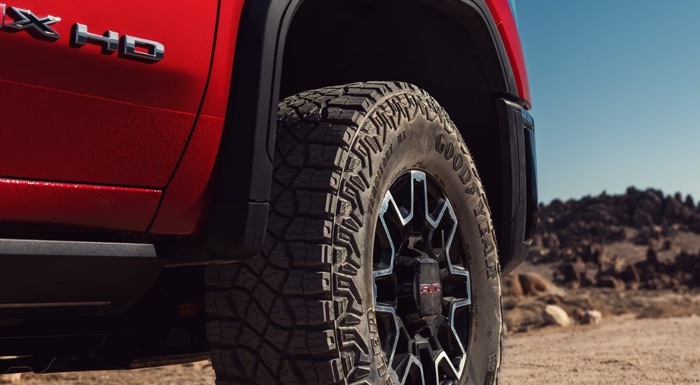 Rim on a red 2025 GMC Sierra 2500 HD AT4X