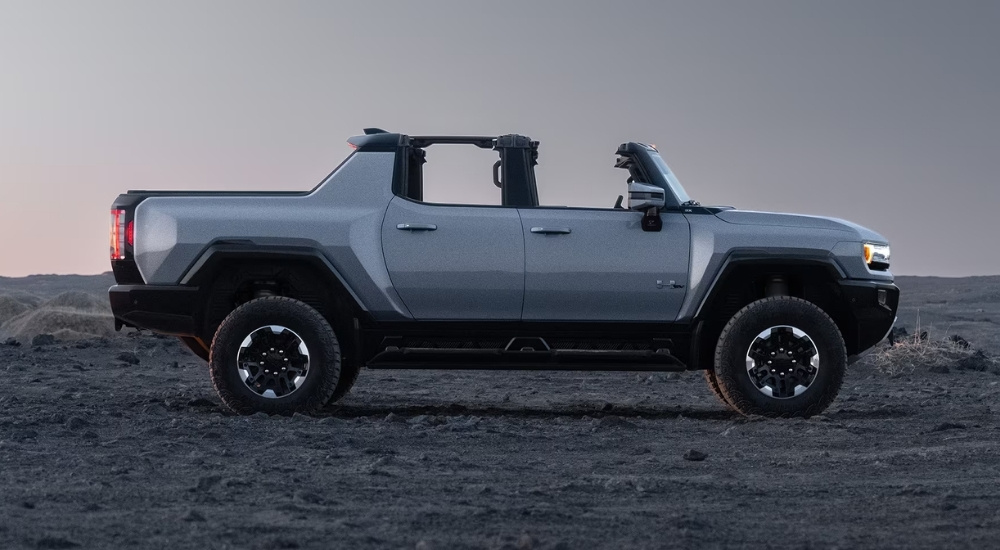 White 2025 GMC Hummer EV parked off-road