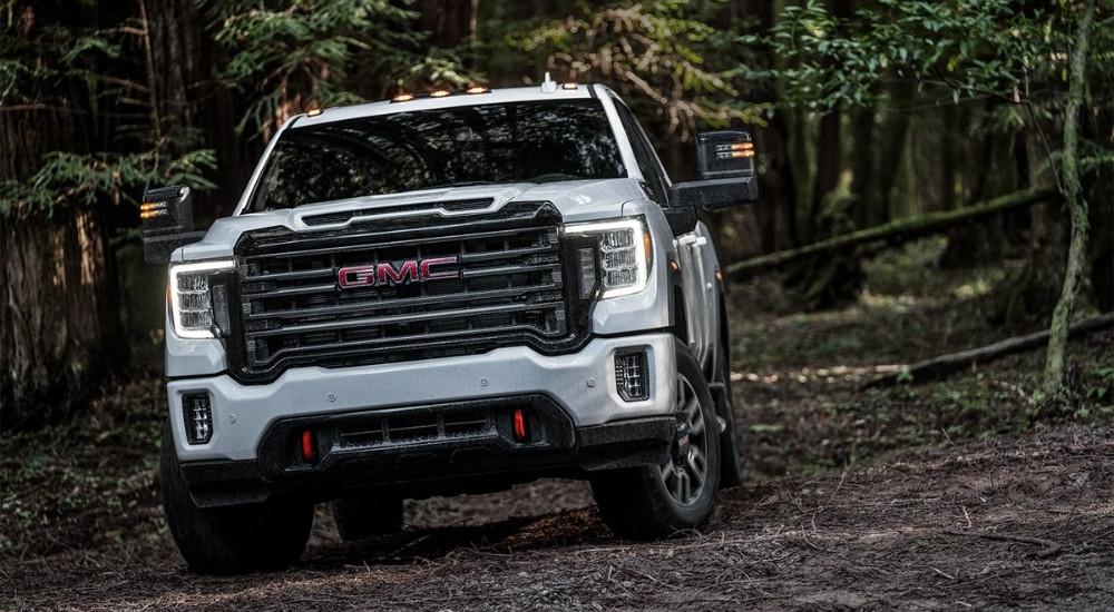 A white 2023 GMC Sierra 2500 HD AT4 from a dealer with used GMC trucks for sale