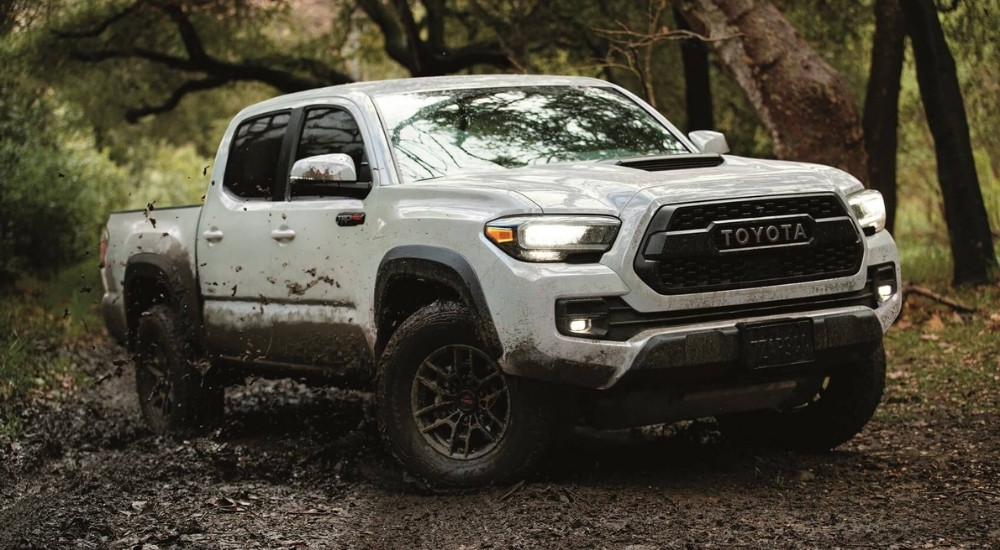 A white 2021 Toyota Tacoma off-roading