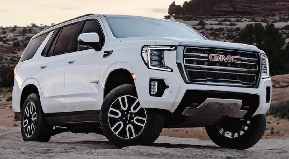 White 2022 GMC Yukon AT4 parked off-road
