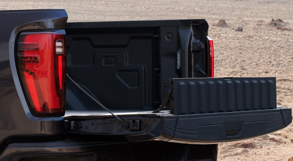 Open tailgate on a black 2026 GMC Sierra 2500 HD