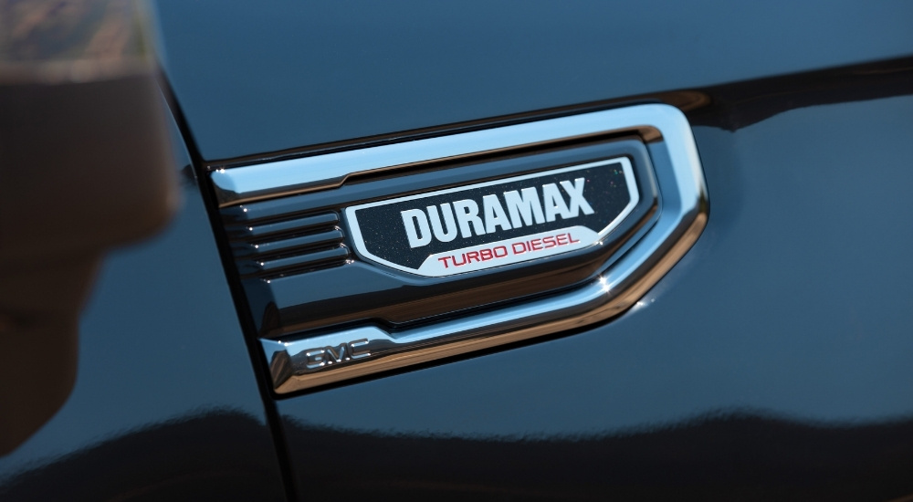 The badge on a black 2025 GMC Sierra 2500 HD in close