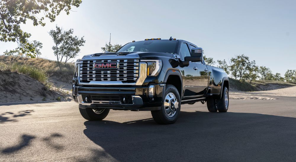 A black 2025 GMC Sierra 3500 HD Denali from the front at an angle.