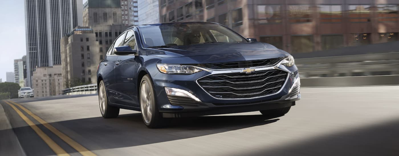 Blue 2022 Chevy Malibu driving
