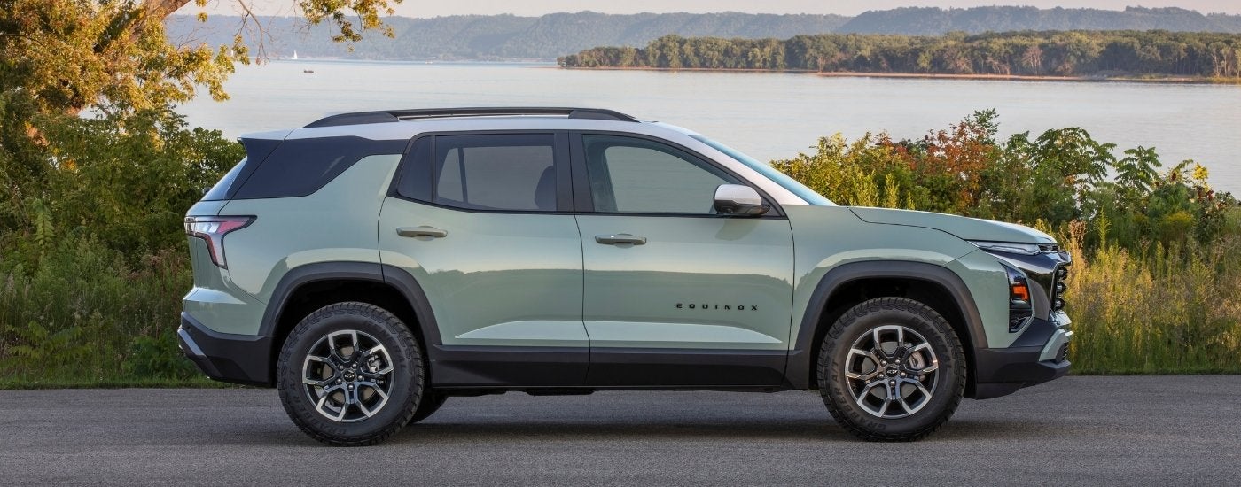 A green 2026 Chevy Equinox from the side.