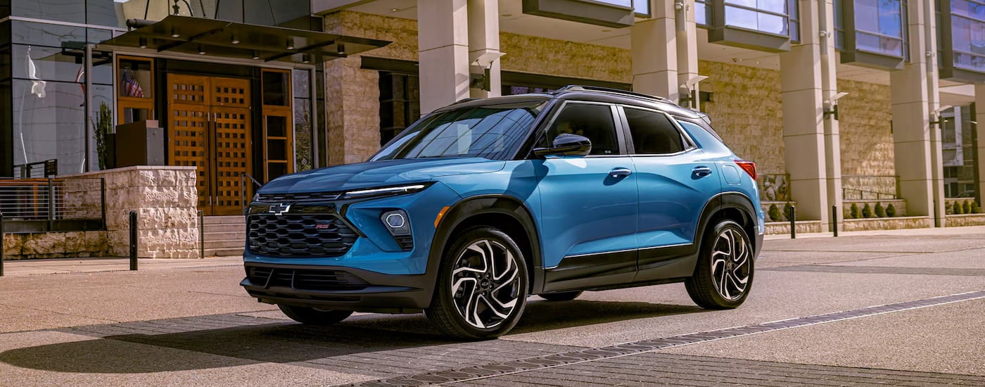A blue 2024 Chevy Trailblazer RS is shown parked close to a Chevy dealer near Savannah.