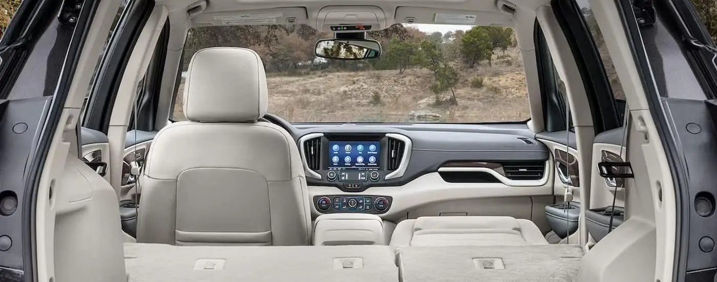 The white and gray interior and dash in a 2024 GMC Terrain for sale is shown.