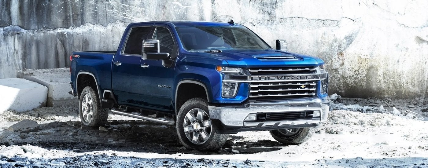 A dark blue 2022 Chevy Silverado 2500 HD parked in a quarry.