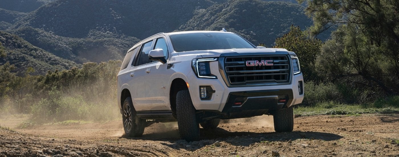 White 2022 GMC Yukon AT4 off-roading