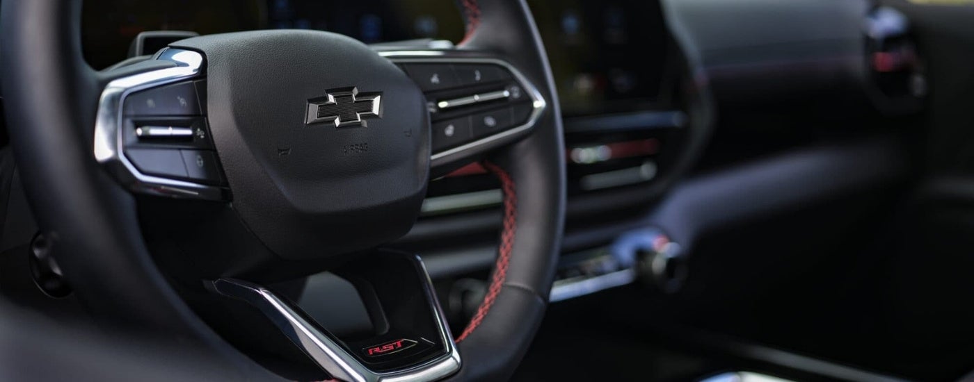 The steering wheel is shown in a 2024 Chevy Silverado EV RST.