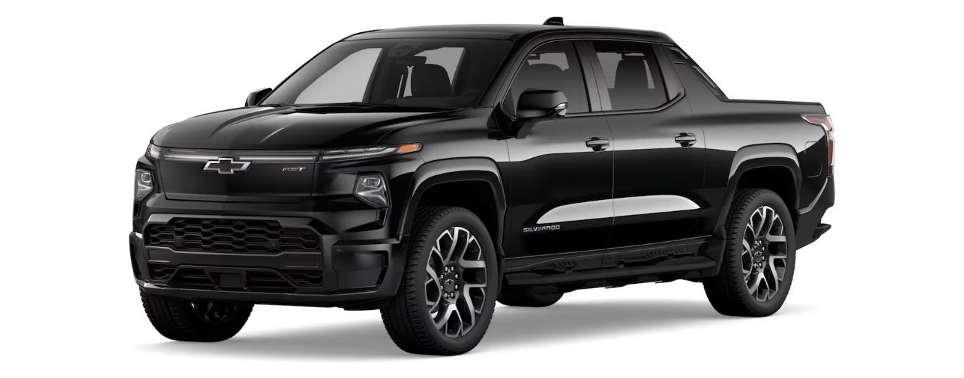 A black 2024 Chevy Silverado EV RST is angled left.