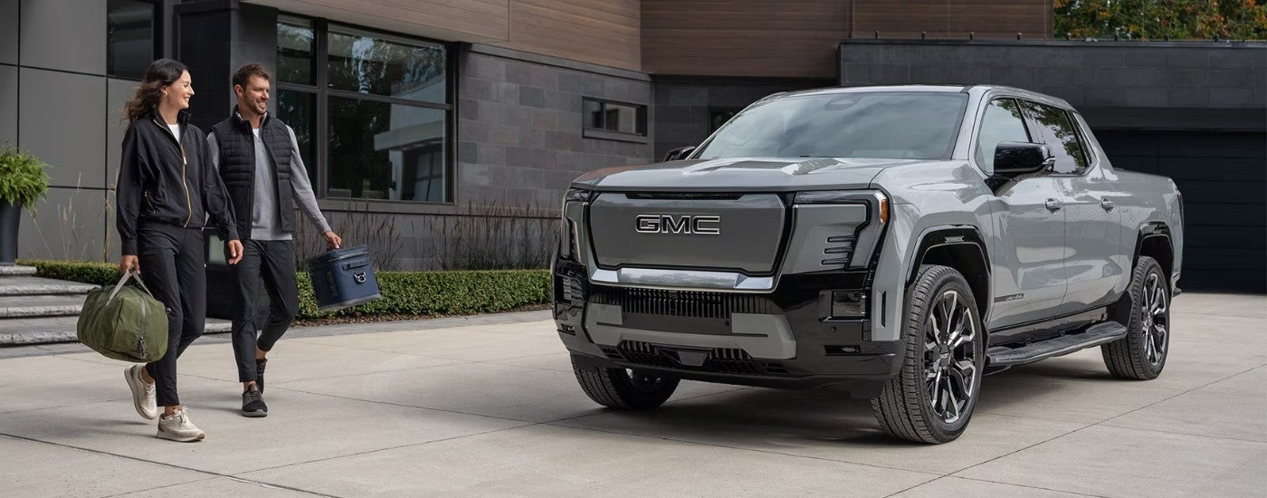 Grey 2024 GMC Sierra EV parked on a driveway