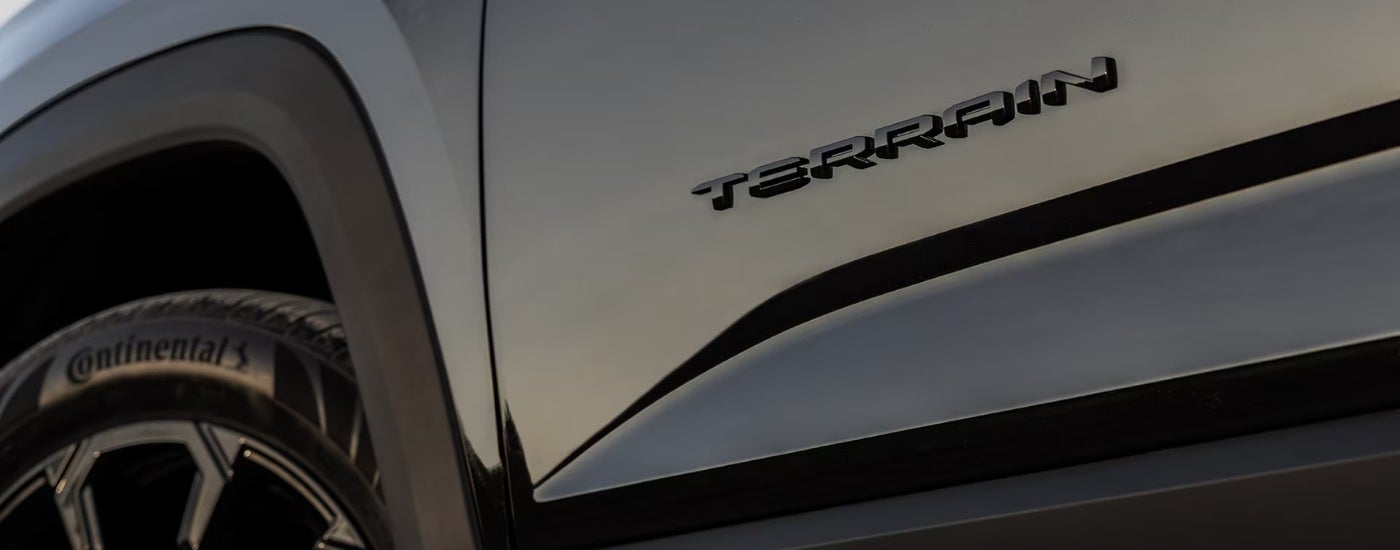 Terrain badge on the door of a black 2025 GMC Terrain Elevation