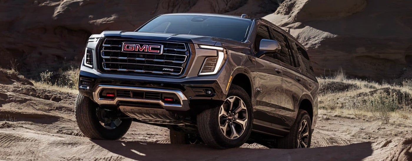 Grey 2025 GMC Yukon AT4 parked off-road