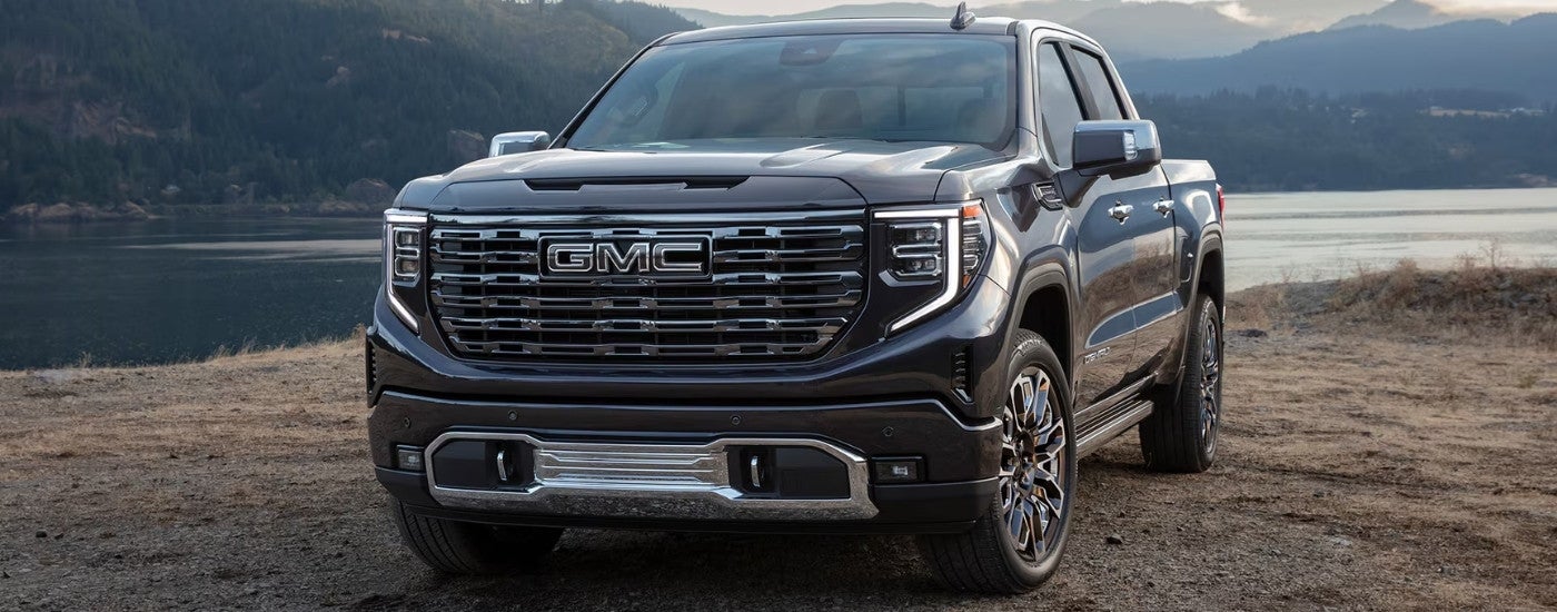Black 2026 GMC Sierra 1500 Denali Ultimate parked near a lake