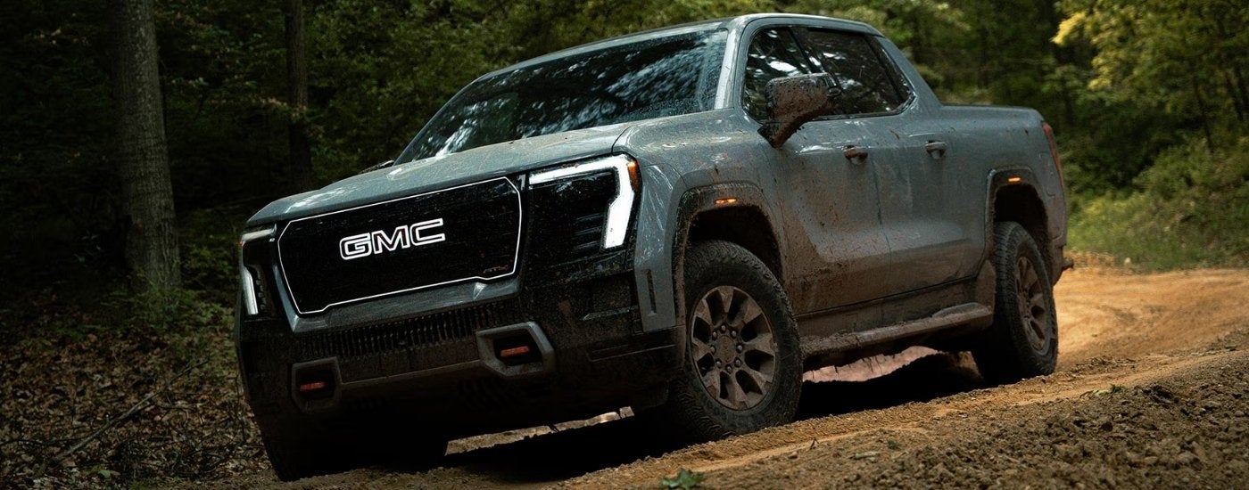 Grey 2026 GMC Sierra EV AT4 off-roading