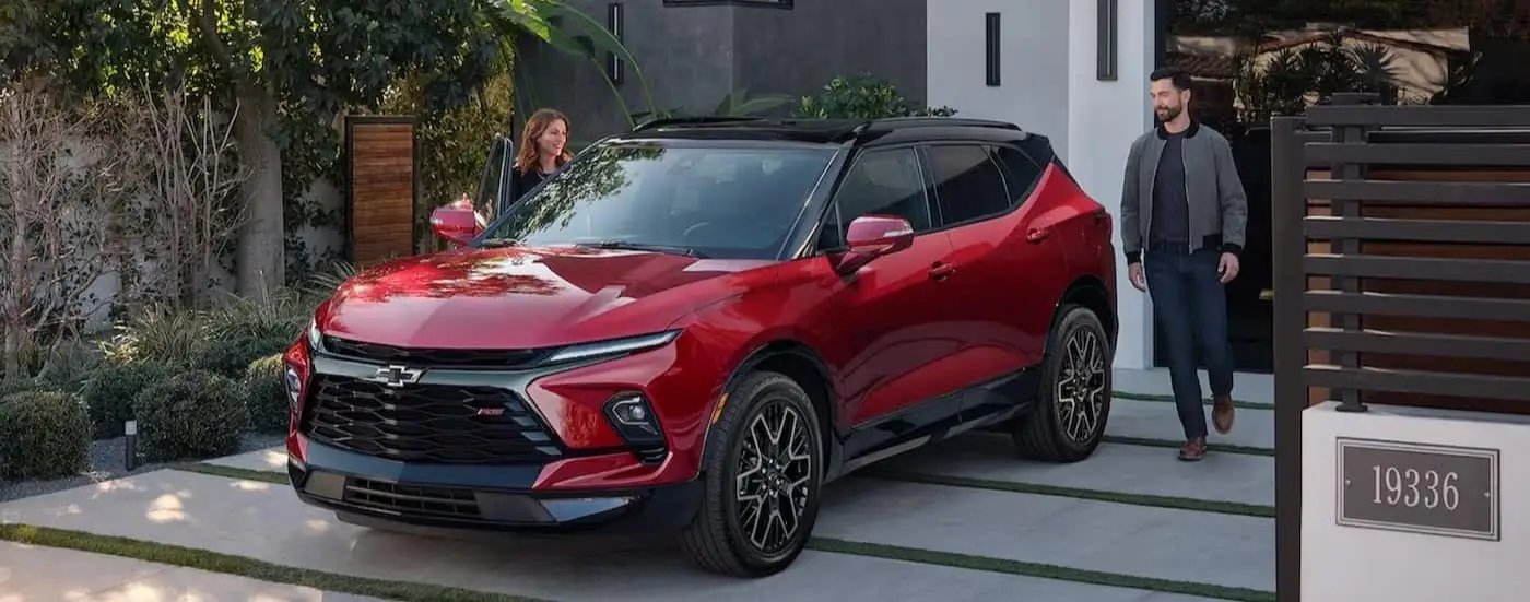 A red 2024 Chevy Blazer RS is shown parked after visiting a Chevy dealer near Baldwyn.
