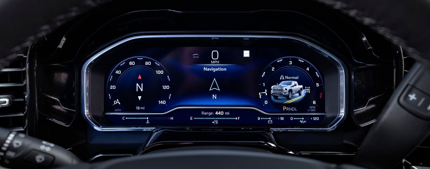 A close up shows the digital gauges in a 2024 Chevy Silverado 2500 HD High Country.