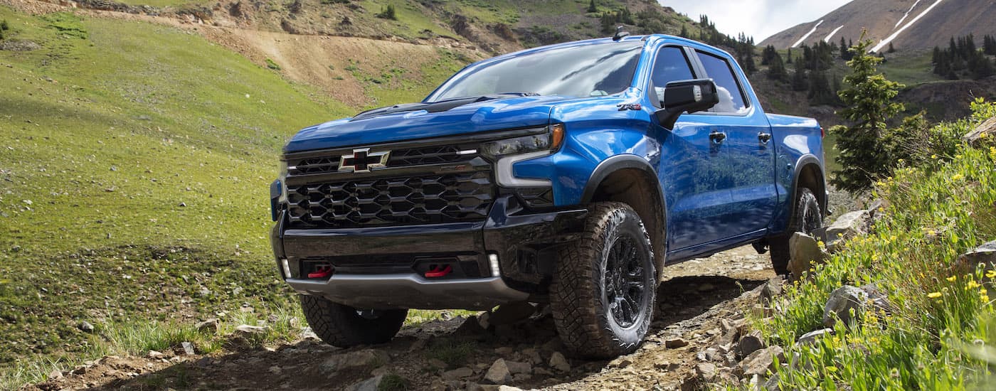 A blue 2022 Chevy Silverado 1500 ZR2 is shown from the front at an angle.