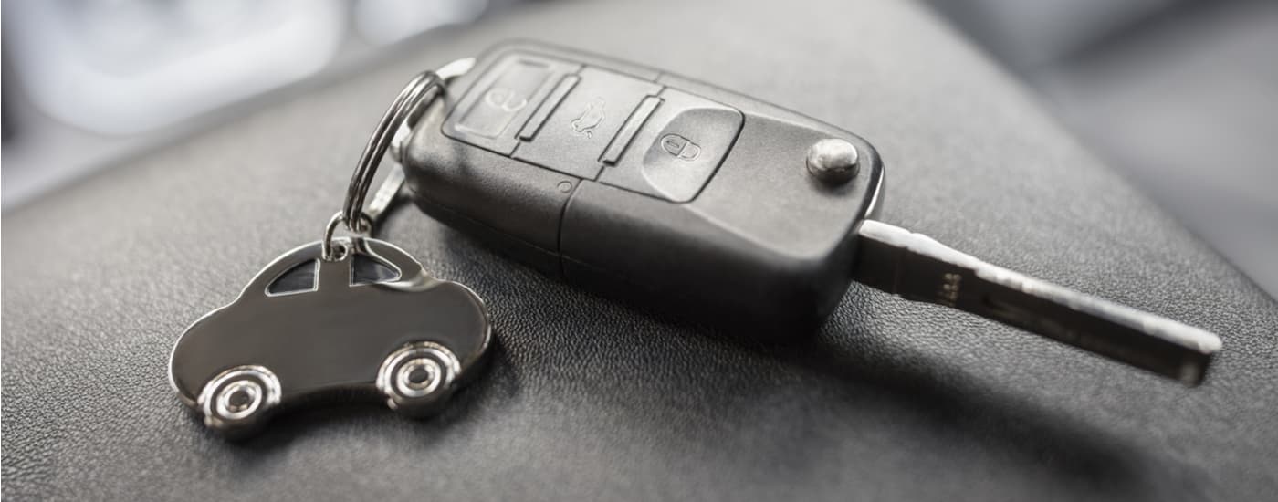 Car key on the center console of a vehicle
