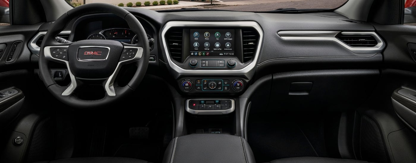 Black interior in a 2023 GMC Acadia for sale.