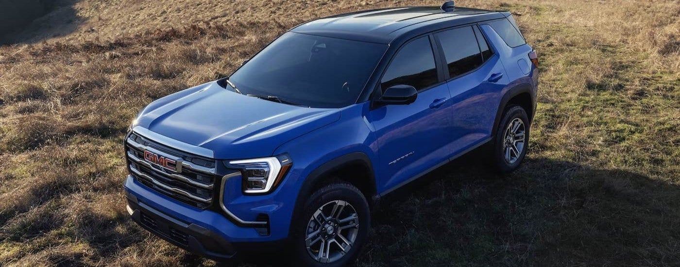 A parked blue 2026 GMC Terrain for sale near Booneville.