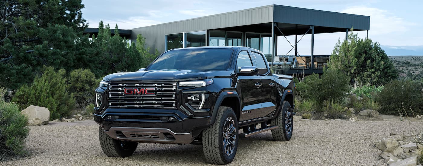Black 2024 GMC Canyon Denali is shown from the front at an angle